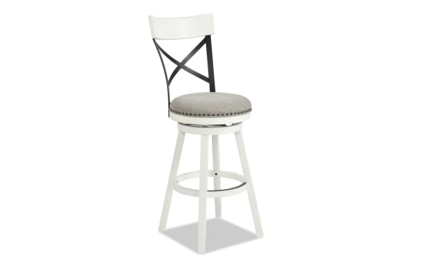 Iris White & Gray Cross Back Upholstered Adjustable Height Swivel Stool with gray polyester fabric seat, nailhead trim, and white rubberwood legs.