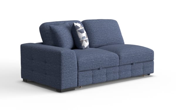 Modern blue fabric sectional sofa with tufted cushions, wide armrest, and decorative patterned throw pillow, ideal for living room seating.