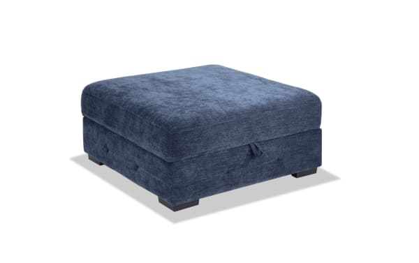 Contemporary Playground Navy Storage Ottoman with plush navy polyester fabric, hand-tufted detailing, memory foam seating, and hidden storage.