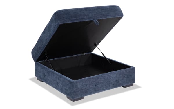 Contemporary Playground Navy Storage Ottoman with navy polyester fabric, hand-tufted detailing, memory foam seating, and spacious storage compartment.