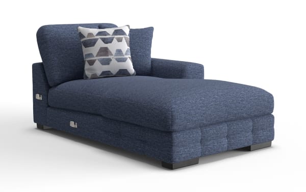 Modern navy blue fabric chaise lounge with tufted base, cushioned backrest, and geometric patterned throw pillow, ideal for living room seating.