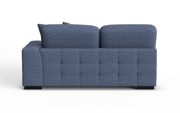 Modern blue fabric sofa with tufted back panel, thick cushions, and low black feet, designed for comfortable living room seating.