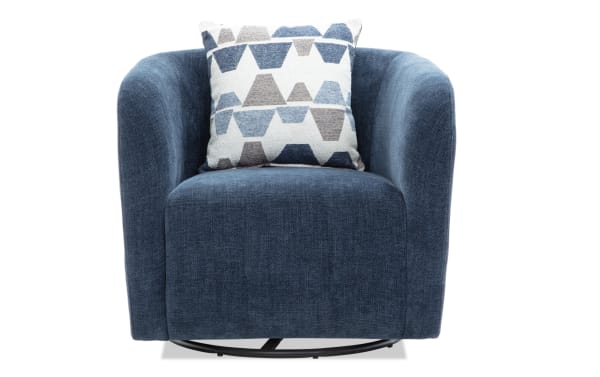 Blue upholstered swivel armchair with rounded arms and a geometric patterned throw pillow in shades of blue and gray, featuring a soft textured fabric.