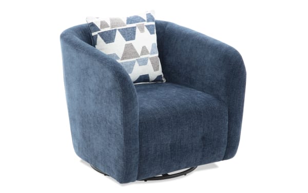 Blue upholstered swivel armchair with rounded arms and a geometric patterned accent pillow, featuring soft fabric and modern design.