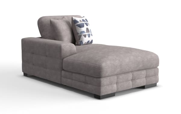 Modern gray fabric chaise lounge with tufted sides, cushioned backrest, and decorative geometric-patterned throw pillow.
