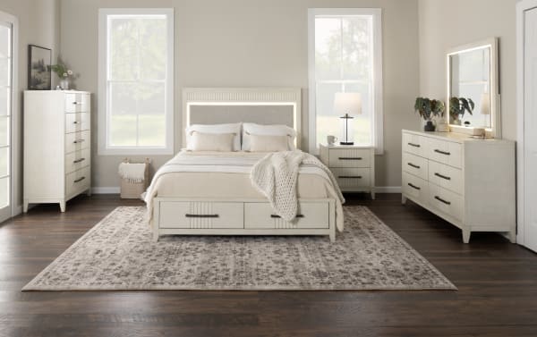 Transitional Laguna Bedroom gray 5-drawer chest in pine solids and veneers with black handles, dovetail joints, and felt-lined top drawer.
