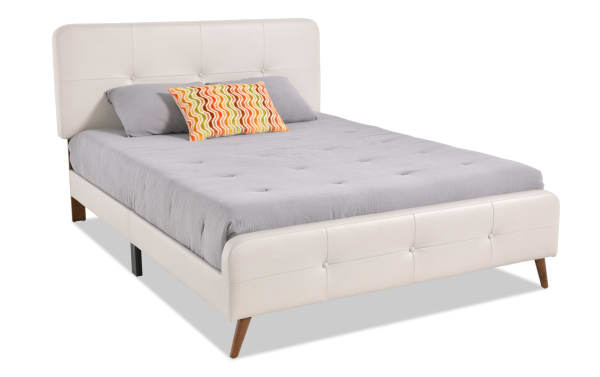 Bettie Twin Cream Faux Leather Upholstered Platform Bed with tufted cream vinyl headboard and footboard, tapered mid-century modern wooden legs.