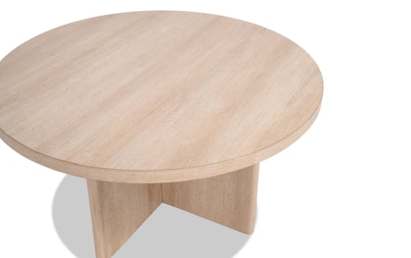 Cascade Light Brown Round Coffee Table from the Cascade Entertainment & Occasional collection, featuring contemporary MDF design with smooth edges and a sturdy cross base.