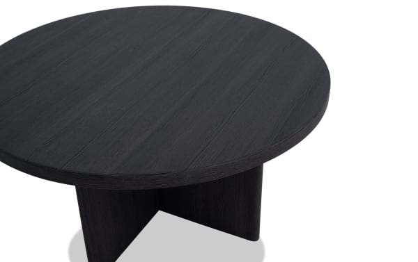 Round black MDF coffee table from the Cascade Entertainment & Occasional collection, featuring a contemporary design with a thick tabletop and sturdy cylindrical base.
