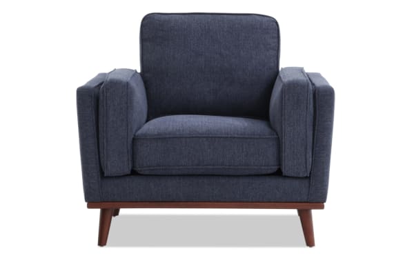 Tribeca Navy Chair in mid-century modern style with blue polyester fabric upholstery, memory foam cushioning, and wooden angled legs for comfort and style.