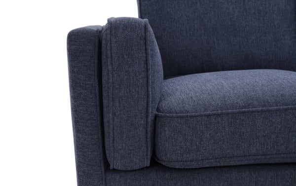 Mid-Century Modern Tribeca Navy Chair in blue polyester fabric with plush memory foam cushioning and matching accent pillow.