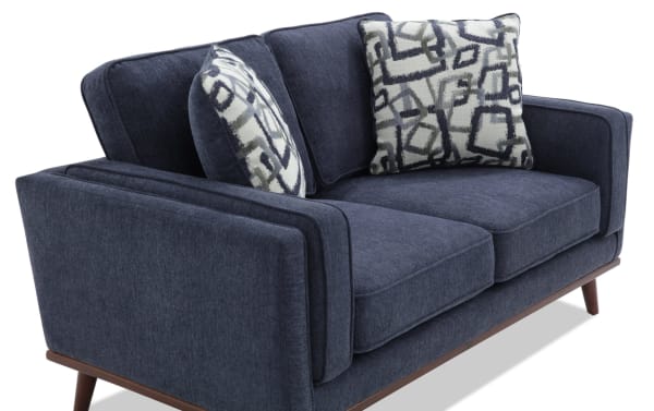 Tribeca Navy 66'' Loveseat in blue polyester fabric with mid-century modern design, memory foam cushions, and patterned accent pillows.