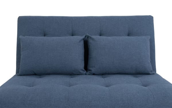 Chadwick Denim Futon in blue polyester fabric with transitional style, featuring a tufted seat and backrest, designed for easy conversion from lounge to bed.