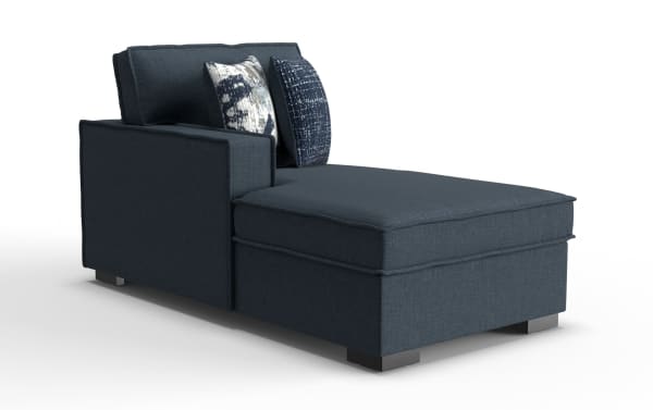 Dark blue upholstered chaise lounge with square armrest, two patterned accent pillows, and low metal block legs, ideal for modern living rooms.