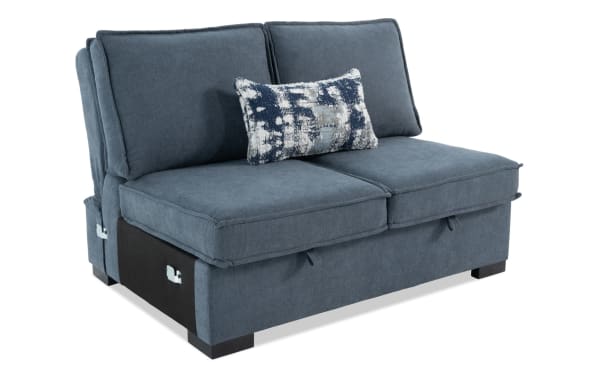 Blue fabric loveseat sofa with plush cushions, dark wooden legs, and a decorative rectangular throw pillow, ideal for modern living rooms.