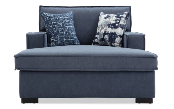 Playmax Denim Chaise Lounge in blue polyester fabric with Bob-O-Pedic memory foam seating, transitional style, and two patterned accent pillows.