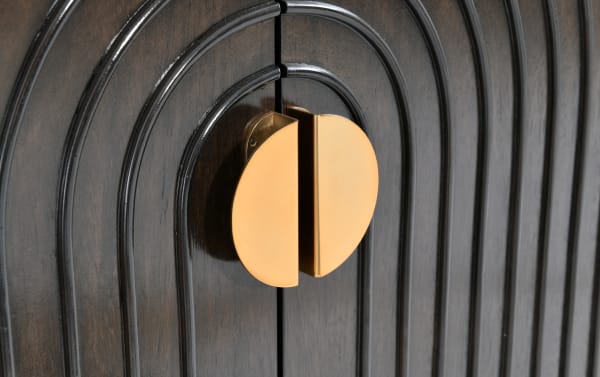 Oasis Espresso 4 Door Cabinet in transitional style, featuring dark mango wood with curved panel details and a distinctive round gold metal handle.