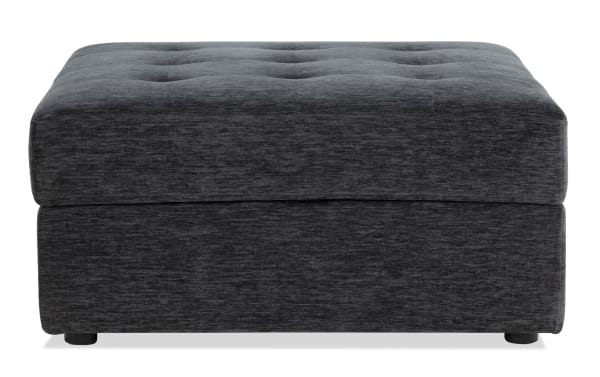 Contemporary Modular Bob® Charcoal Storage Ottoman in gray polyester fabric with tufted top, memory foam cushioning, and hidden storage space.