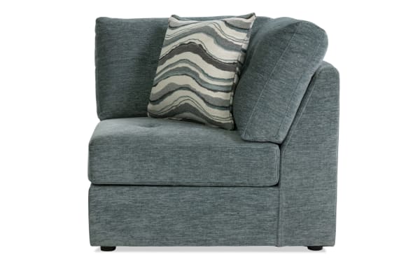 Contemporary Modular Bob® Spa Blue Corner sofa in light blue polyester fabric with plush memory foam cushions and wave-patterned accent pillow.