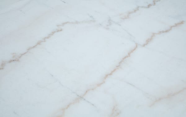 Elm Natural & Marble Coffee Table from Elm Occasional collection features a sleek white marble top with subtle gray and beige veining on a minimalist frame, blending transitional style with durable marble and MDF materials for a unique, contemporary living room centerpiece.