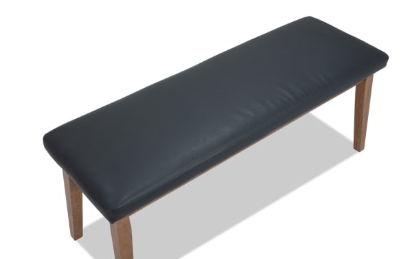 Elm Natural & Gray faux leather upholstered dining bench with foam padding, wood legs, and transitional style from the Elm Dining collection