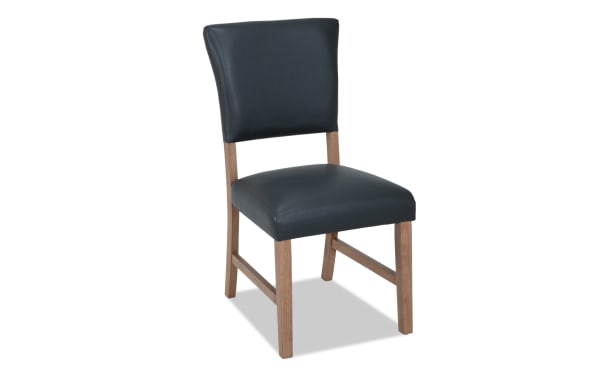 Transitional Elm Dining chair with gray foam-filled faux leather upholstery, natural wood legs, and a panel back for comfortable dining seating.