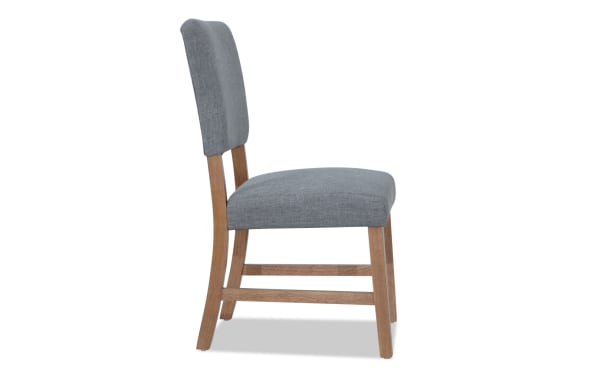 Transitional Elm Dining Chair with light gray polyester fabric upholstery and natural wood legs, featuring a panel back and sturdy engineered wood frame.