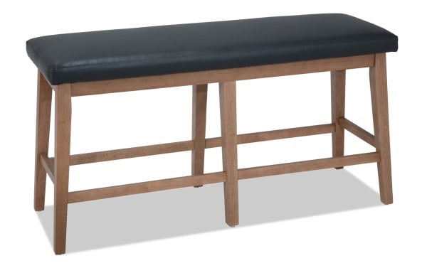 Elm Natural & Gray faux leather upholstered counter height dining bench with foam padding, sturdy wood legs, and transitional style from Elm Dining collection