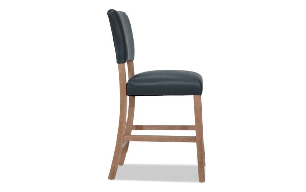 Transitional Elm Dining counter height stool with gray foam-filled faux leather upholstery, MDF frame, and panel back design.