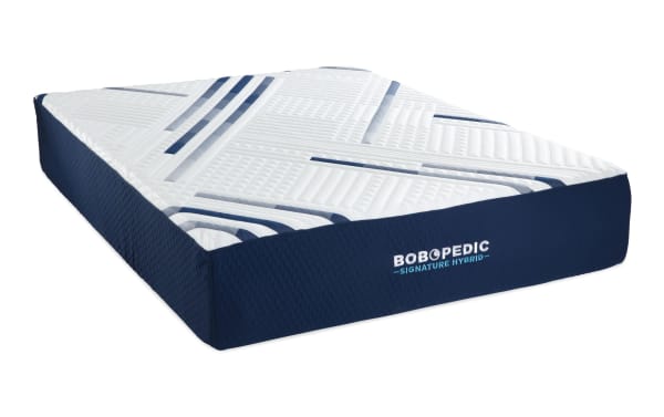 Signature Hybrid 13.5" Queen Plush Mattress by Bob-O-Pedic, with a white quilted top featuring blue geometric patterns and a navy blue side panel, offering gel memory foam and hybrid support for customizable plush comfort.