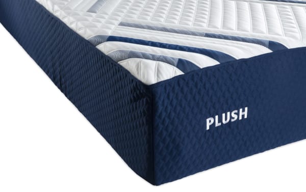 Signature Hybrid 13.5'' Queen Dual Mattress from Bob-O-Pedic Signature collection with quilted white top, blue geometric patterned sides, and "PLUSH" embroidered text.