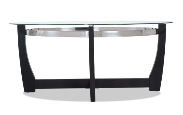 Mirage Black Oval Coffee Table with tempered glass top, black birch veneer curved legs, and metal accents from Mirage Entertainment & Occasional collection.