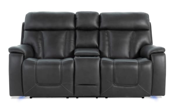 Showcase Black Leather 77'' Immersive Audio Power Reclining Console Loveseat with transitional style, leather upholstery, cup holders, and center storage console.