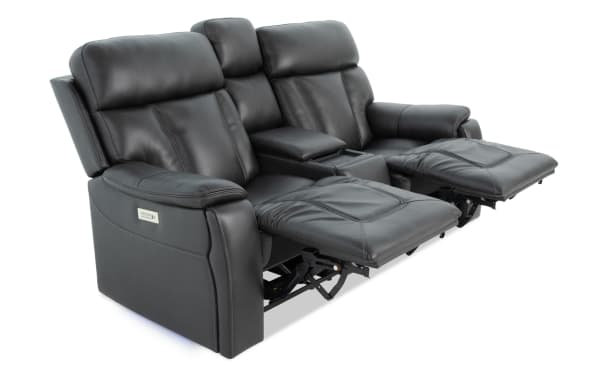 Black leather 77" Showcase transitional power reclining console loveseat with memory foam, cup holders, USB ports, LED lighting, and immersive audio.