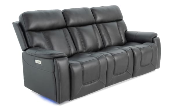 Showcase Black Leather 89'' Immersive Audio Power Reclining Sofa with transitional style, full leather upholstery, cup holders, and LED lighting.