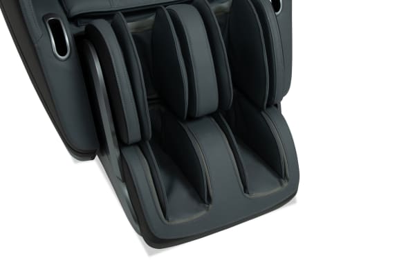 Black and gray Stargazer massage recliner footrest with 3D massage mechanism, faux leather upholstery, and transitional style detailing.