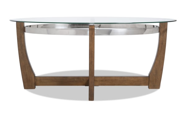 Mirage Brown Oval Coffee Table with tempered glass top, birch veneer curved legs, and metal ring detail from Mirage Entertainment & Occasional collection.