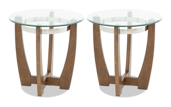 Pair of round glass top side tables with wooden curved legs and metal ring support, modern design for living room or office decor.