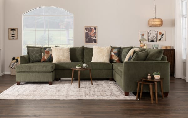 Transitional Brynn Green Ottoman sectional sofa set in green polyester fabric with plush cushions, patterned throw pillows, and cozy foam footrest.