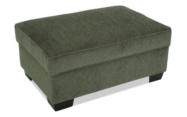 Brynn Green Storage Ottoman in soft green polyester fabric, transitional style with cushioned top and hidden storage, from the Brynn collection.