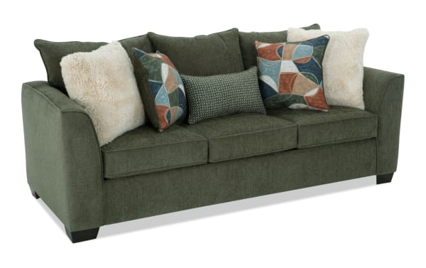 Brynn Green 88'' transitional sofa in soft green polyester fabric with memory foam cushions and mixed patterned and plush accent pillows.