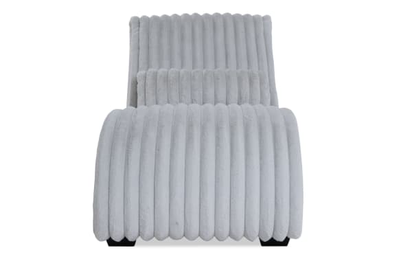 Sofia Gray Chaise in gray polyester fabric with channel tufted cushions, faux fur pillow, and Bob-O-Pedic memory foam for transitional style comfort.