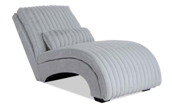 Sofia Gray Chaise in gray polyester fabric with channel tufted cushions, faux fur pillow, and Bob-O-Pedic memory foam for transitional style comfort.