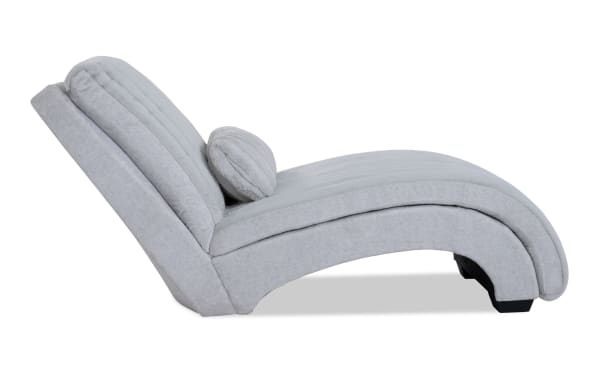 Sofia Gray Chaise in gray polyester fabric with channel tufted back cushions, faux fur pillow, and memory foam for transitional style comfort.