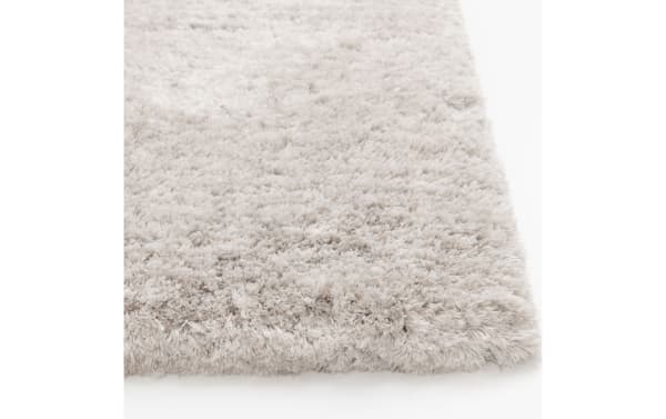 Light gray Sherpa 8' x 10' solid shag rug with ultra-plush polyester fabric and thick pile, transitional style for cozy flooring.