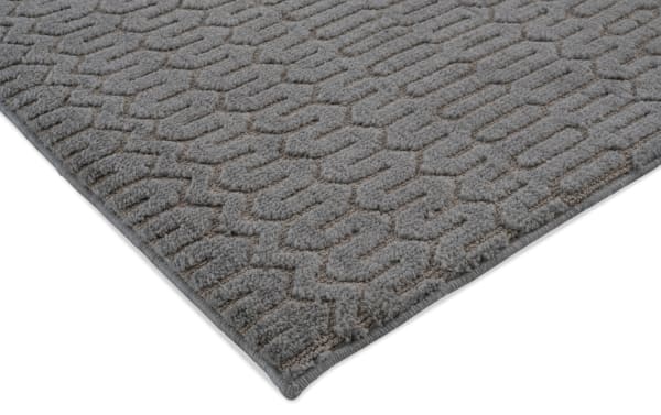 Charcoal gray Ella 5' x 7' transitional area rug with raised geometric pattern, made of soft polyester fabric with memory foam cushioning.