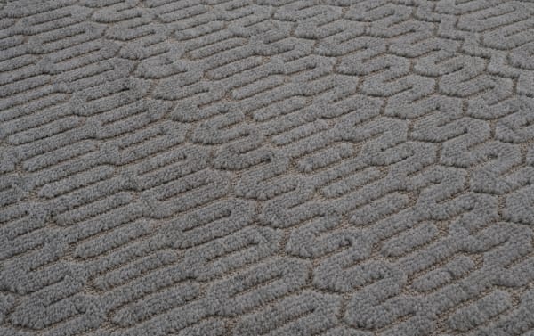 Charcoal gray Ella 5' x 7' transitional area rug with raised geometric pattern, made of soft polyester fabric with memory foam cushioning.