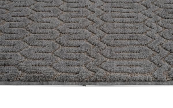 Charcoal gray Ella 5' x 7' transitional area rug with raised geometric pattern, made of soft polyester fabric with memory foam cushioning.