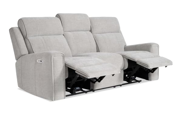 Athens Cream 85'' power reclining sofa with power headrest in beige polyester fabric. Transitional style with dual recliners, plush cushioning, and ergonomic support.