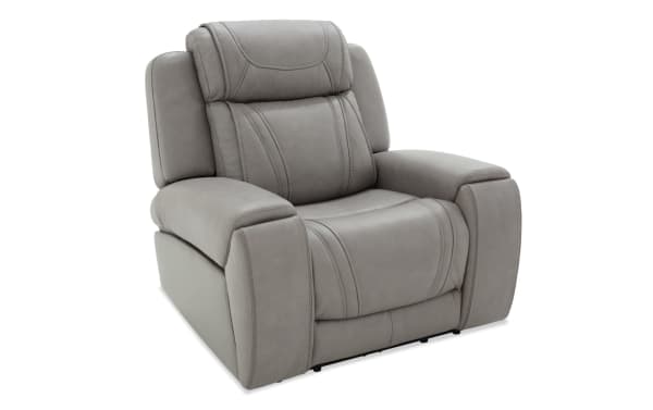 Dynamic Gray Leather Power Recliner with Power Headrest from the Dynamic collection, featuring gray leather upholstery, transitional style, padded armrests, and a plush cushioned back.